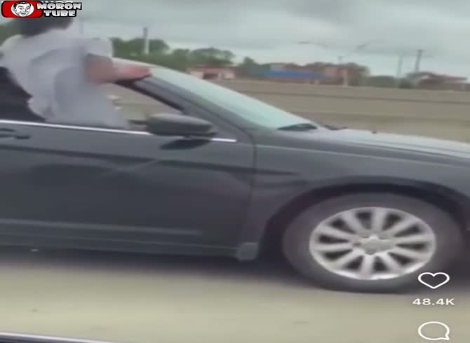 Video :While attempting to urinate on the road, he tumbles out of the vehicle